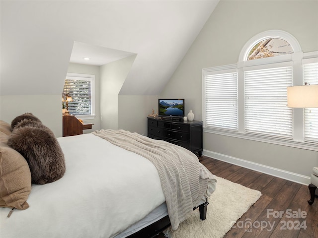 bedroom with lofted ceiling and dark wood-type flooring