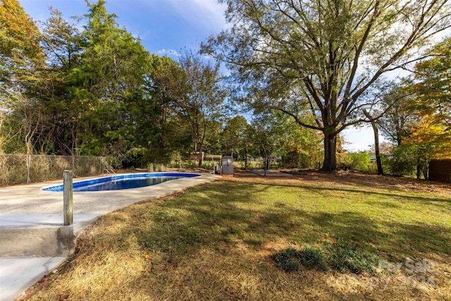 view of yard with a fenced in pool and a patio area