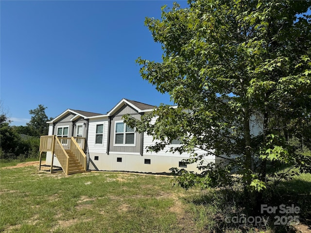 exterior space featuring crawl space, a yard, a deck, and stairs