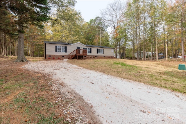 manufactured / mobile home featuring a wooden deck