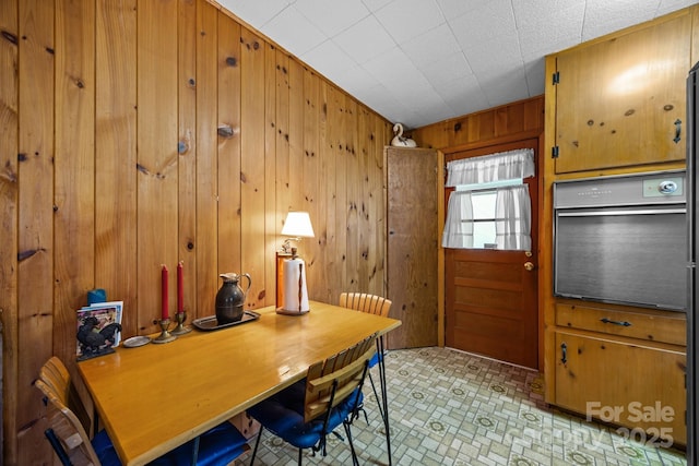 office area with wood walls