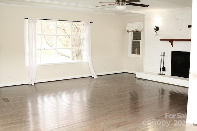 unfurnished living room with crown molding, ceiling fan, and hardwood / wood-style flooring