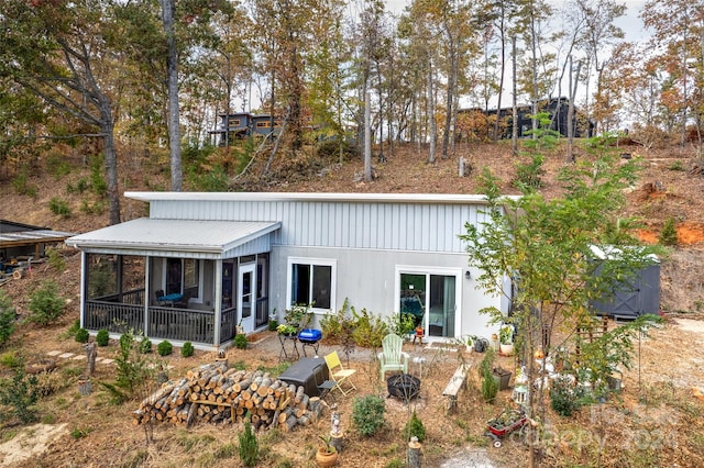 back of house featuring a sunroom