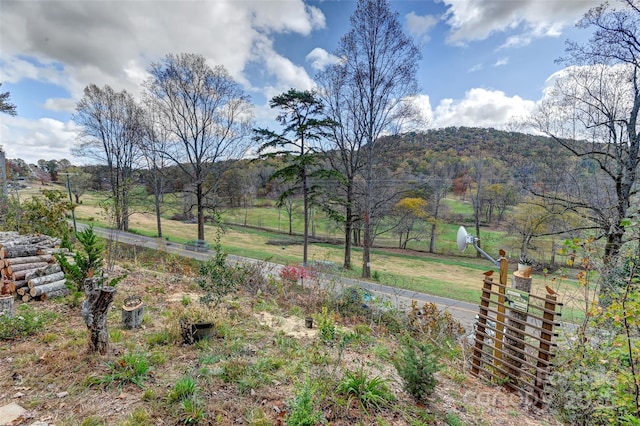 exterior space with a rural view and a mountain view