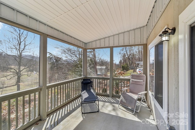 sunroom featuring lofted ceiling