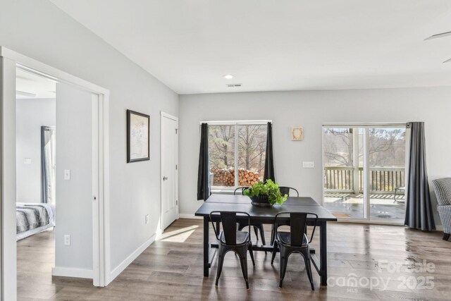 dining area with recessed lighting, visible vents, baseboards, and wood finished floors