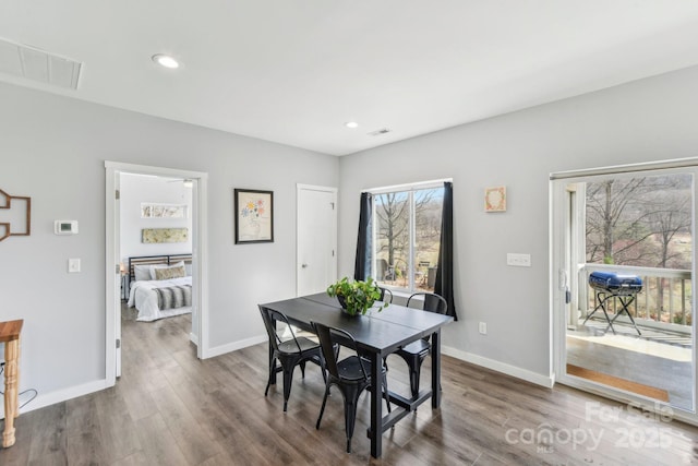 dining room featuring recessed lighting, wood finished floors, visible vents, and baseboards