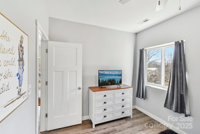 interior space with baseboards, visible vents, and light wood-style floors