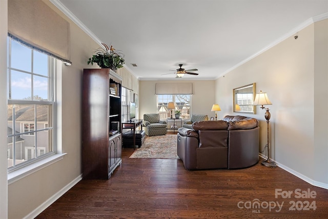 living room with ornamental molding, ceiling fan, and dark hardwood / wood-style flooring