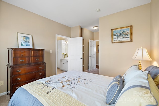 carpeted bedroom with ensuite bathroom