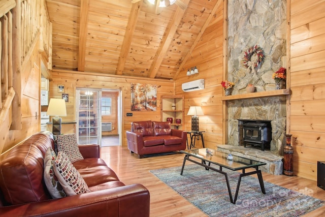 living room with wooden ceiling, wood walls, beam ceiling, wood-type flooring, and a wood stove