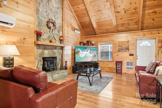 living room with a wood stove, hardwood / wood-style floors, wood walls, wooden ceiling, and beamed ceiling