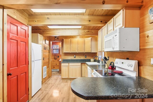 kitchen with white appliances, beamed ceiling, sink, and light hardwood / wood-style flooring