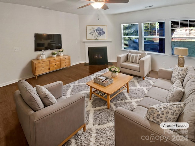 living room with hardwood / wood-style flooring, ceiling fan, and a wealth of natural light