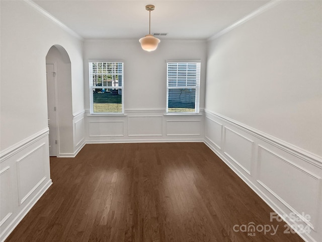 unfurnished dining area featuring crown molding and dark hardwood / wood-style floors