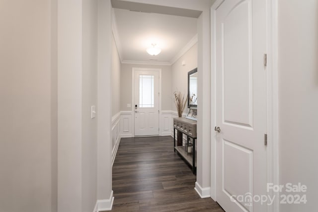 interior space featuring dark hardwood / wood-style flooring and ornamental molding