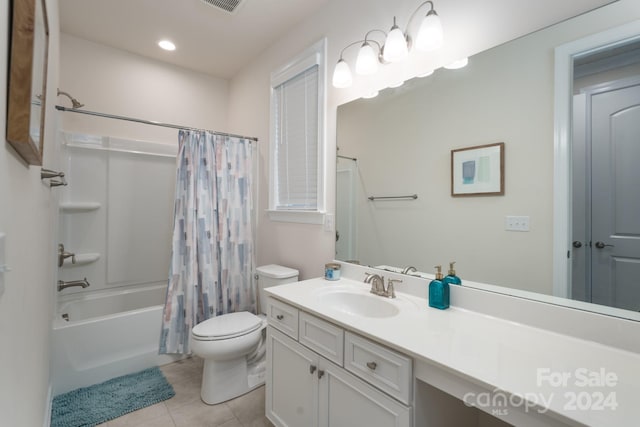 full bathroom featuring vanity, tile patterned floors, shower / bathtub combination with curtain, and toilet