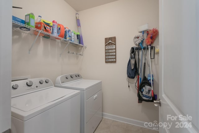 washroom with light tile patterned flooring and independent washer and dryer