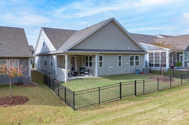 back of property featuring a patio and a yard