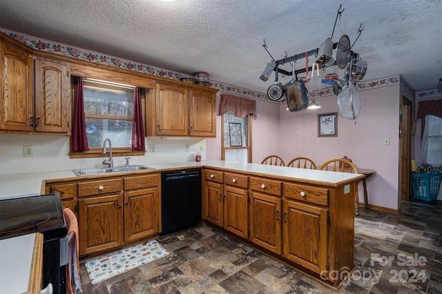 kitchen with sink, kitchen peninsula, a textured ceiling, range, and dishwasher