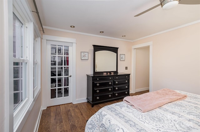 bedroom featuring dark hardwood / wood-style flooring, ornamental molding, and ceiling fan