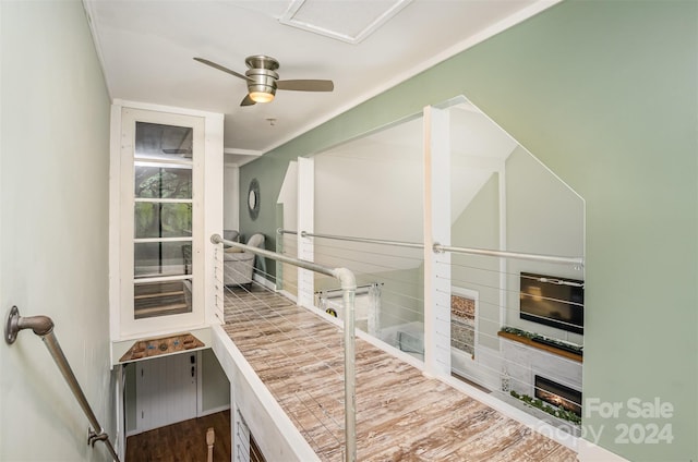 staircase with ceiling fan