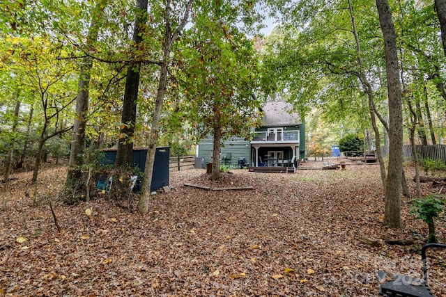 rear view of house with a wooden deck