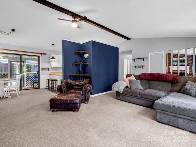 living room featuring lofted ceiling with beams, carpet flooring, and ceiling fan