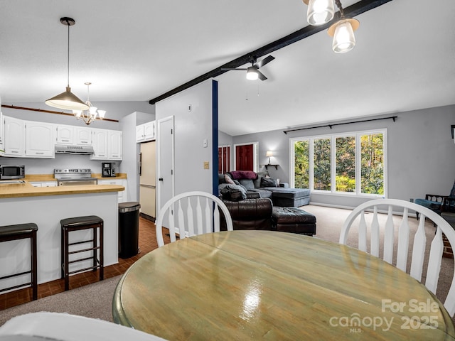 dining space with lofted ceiling and ceiling fan with notable chandelier