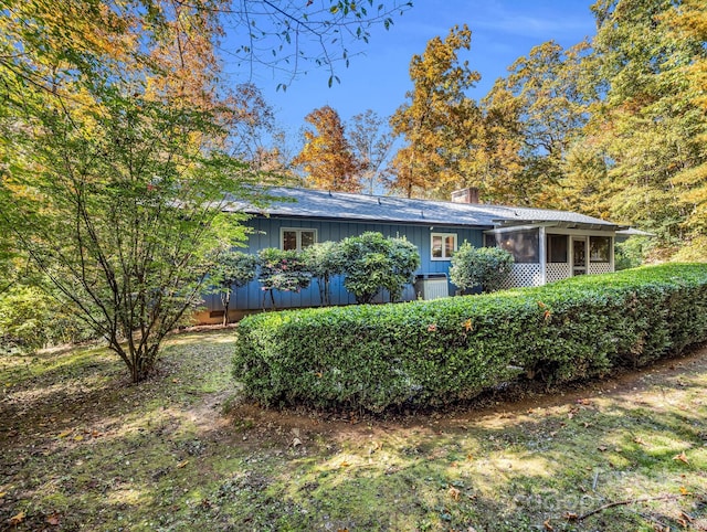 view of front of home with a sunroom