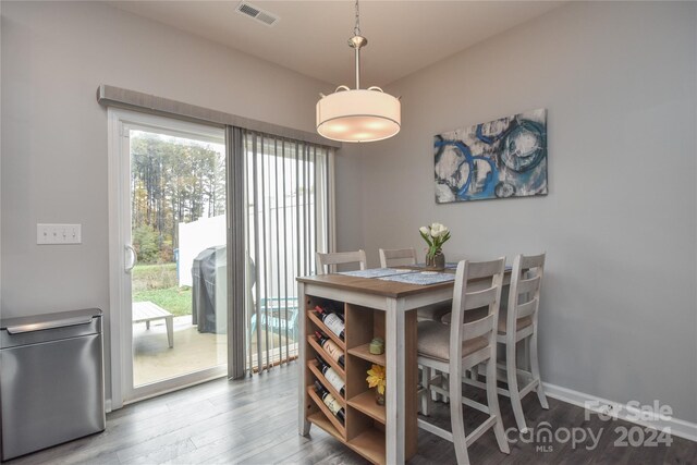 dining area with wood-type flooring