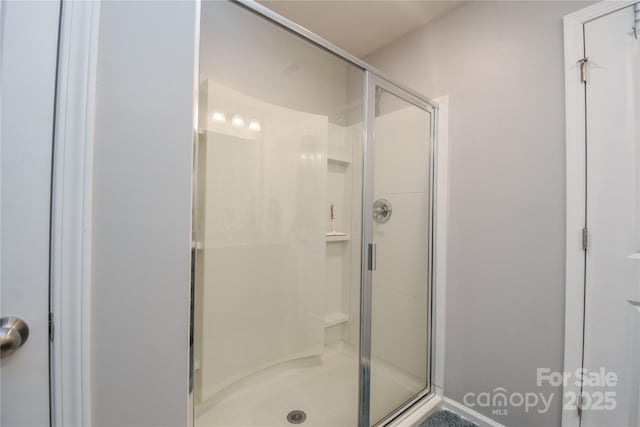 bathroom featuring a shower stall