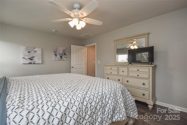 bedroom featuring visible vents, baseboards, ceiling fan, and dark wood-style floors