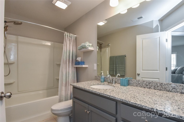bathroom featuring tile patterned floors, visible vents, toilet, vanity, and shower / tub combo
