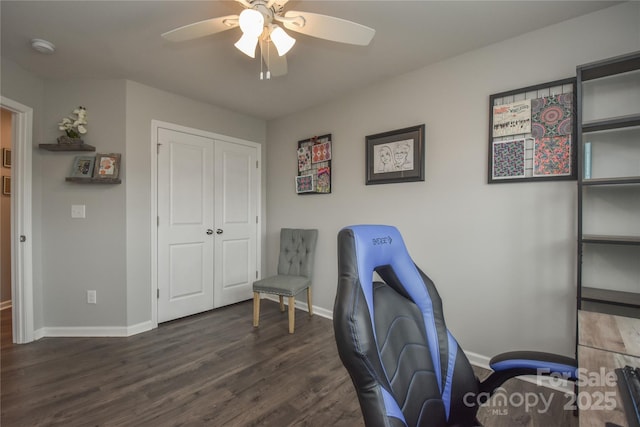 home office featuring a ceiling fan, baseboards, and dark wood-style flooring