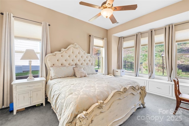 carpeted bedroom with ceiling fan