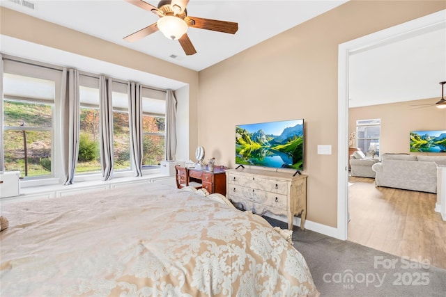 carpeted bedroom with ceiling fan