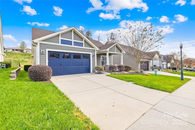 view of front of property with a garage and a front lawn