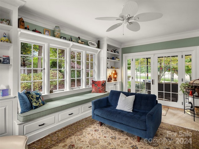 sunroom / solarium with a wealth of natural light, french doors, and ceiling fan