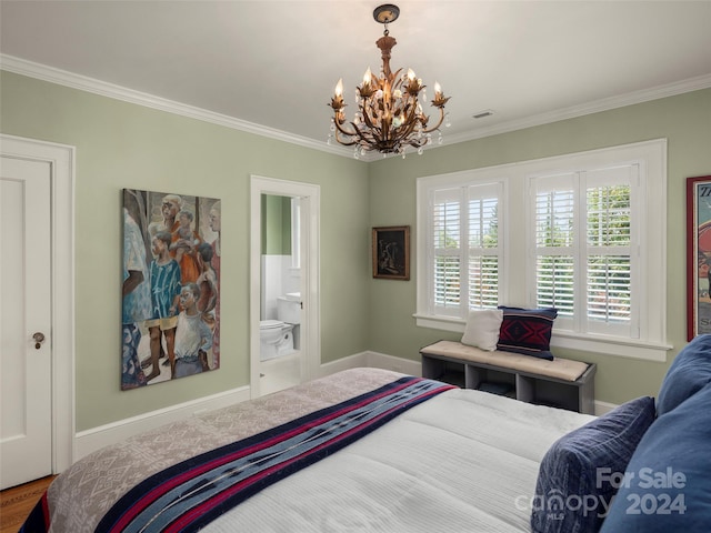 bedroom with crown molding, hardwood / wood-style floors, a notable chandelier, and connected bathroom