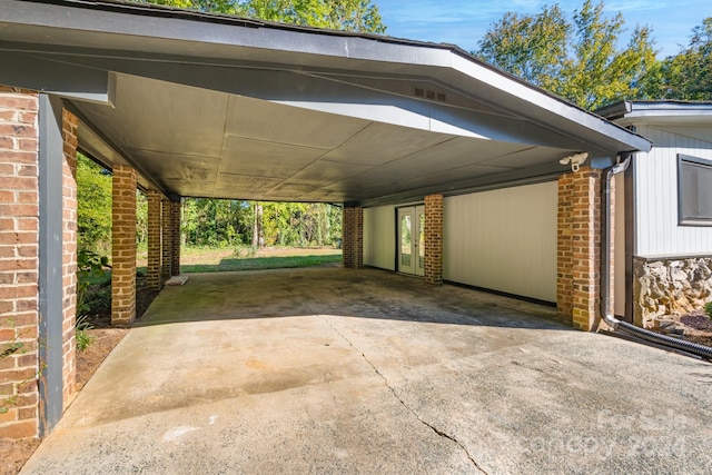 view of vehicle parking featuring a carport