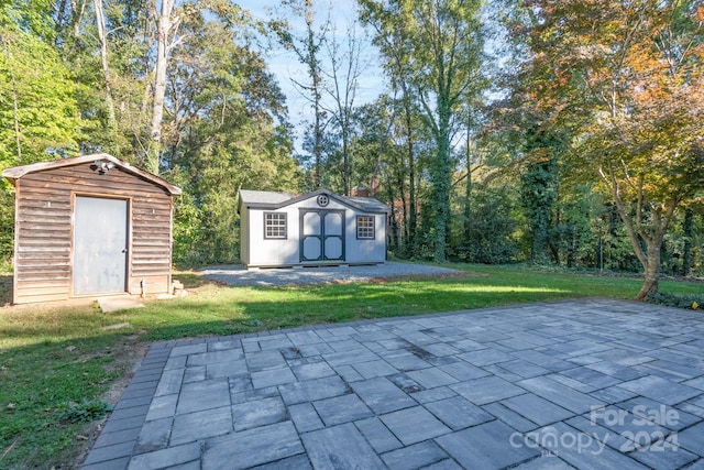 view of outdoor structure featuring a lawn