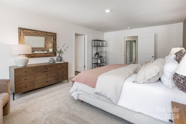 bedroom featuring light colored carpet