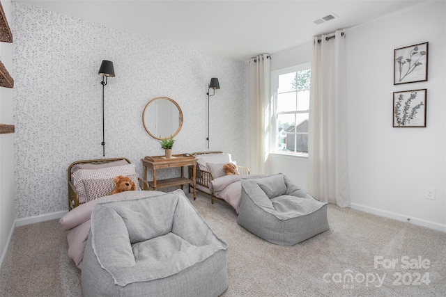 living area with light colored carpet