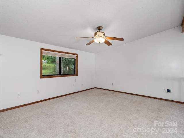 empty room with carpet flooring and ceiling fan