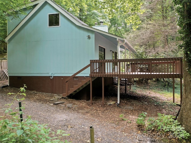 view of side of property featuring a deck