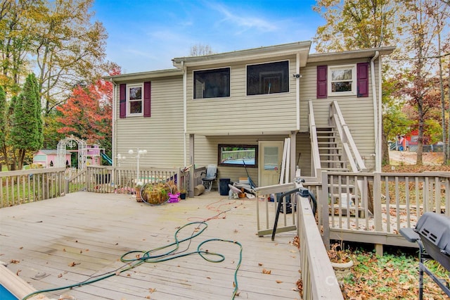 back of property featuring a deck