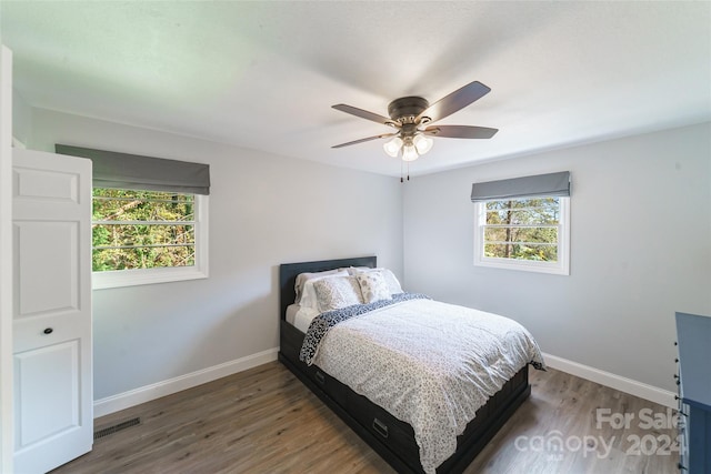 bedroom featuring hardwood / wood-style flooring and ceiling fan