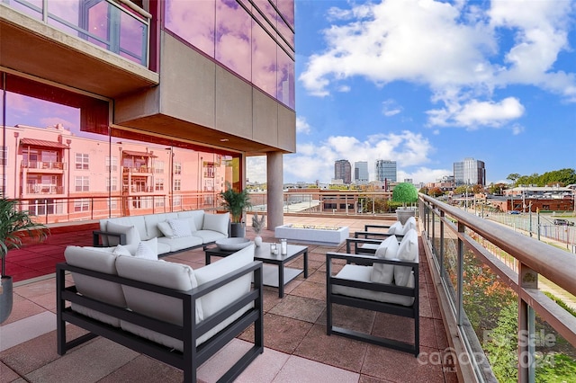 view of patio with a balcony and an outdoor living space