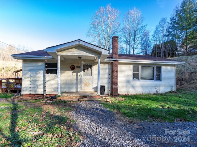 ranch-style home with covered porch